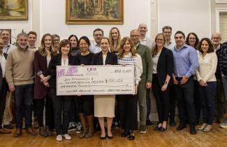 QEII physicians stand with photo of cheque 