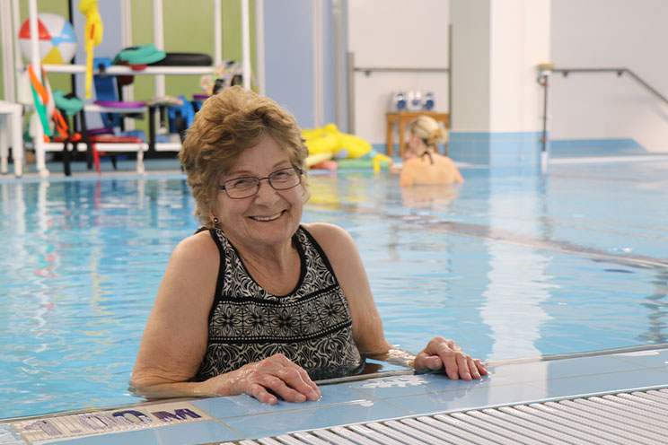 Marilyn Callohan receiving warm-water aquatic therapy in the  The Grace Hansen Therapeutic Pool.