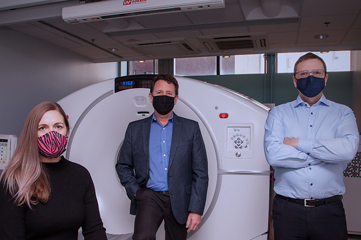 Left to right: Sharon Needham(neuroendocrine cancer patient), Dr. Daniel Rayson and Dr. Steven Burrell in front of the donor-funded PET-CT.