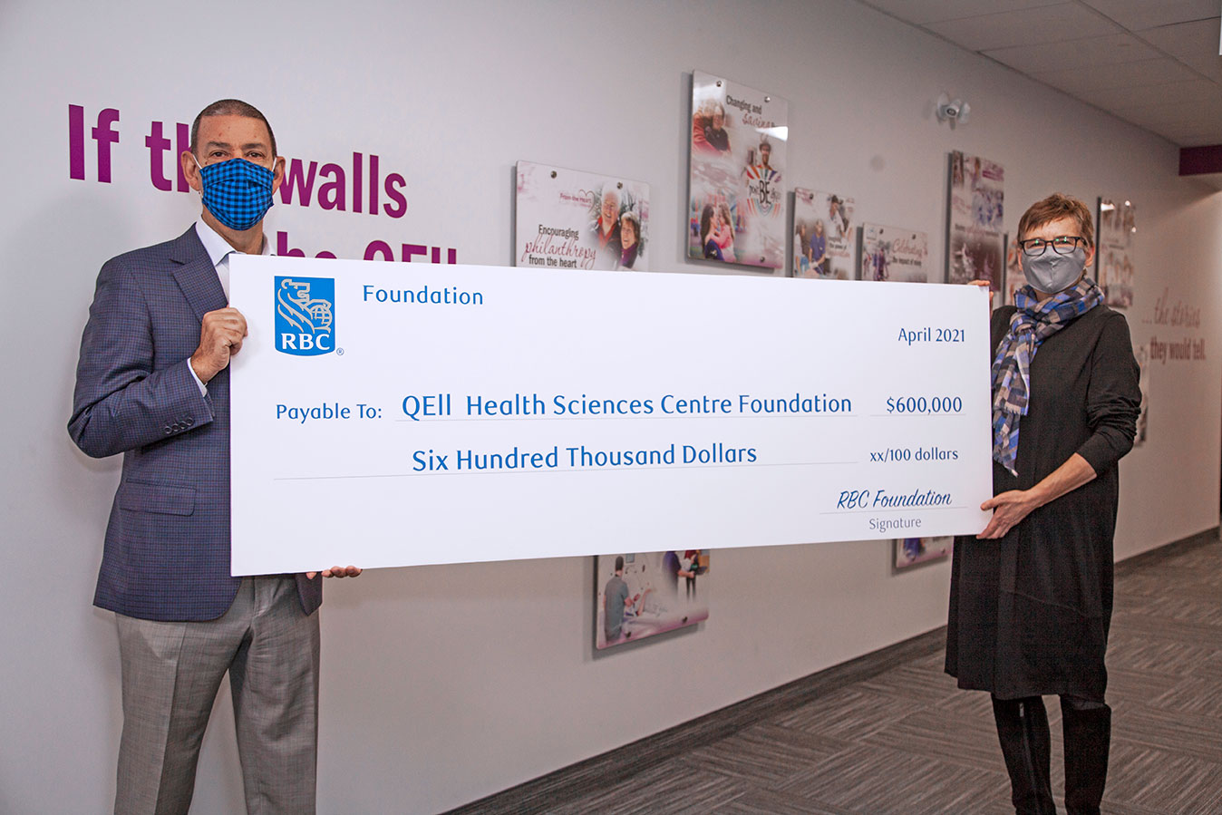 RBC Foundation rep hands over a cheque to QEII Foundation