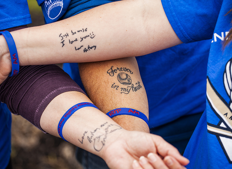 Pictured: Anthony Miller Memorial Lob Ball Tournament event participants show their heartfelt memorial tattoos in honour of Anthony. 