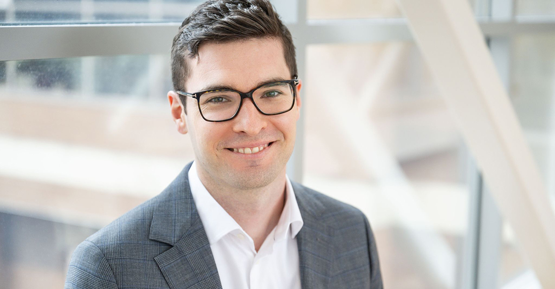 Dr. Phillipe Tremblay smiles in a well lit area
