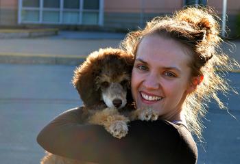 Jocelyn Paul, 2020 Diversity in Health Care Bursary recipient, enjoying the fall sunshine with her miniature poodle puppy, Mary.