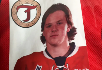 Portrait of young man (Jordan Boyd) wearing hockey uniform