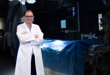Dr. David Clarke, QEII neurosurgeon stands in a surgery room