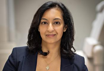 Dr. Ratika Parkash looks into the camera in a heart health treatment space.