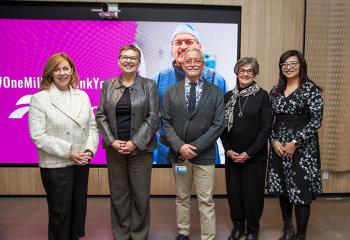 A group of five people from the QEII Foundation, Emera, Nova Scotia Health and the community pose for a photo after the funding announcement.