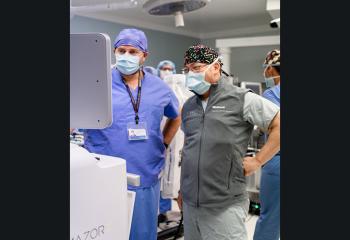 QEII surgeons work with the new spinal surgical robot.