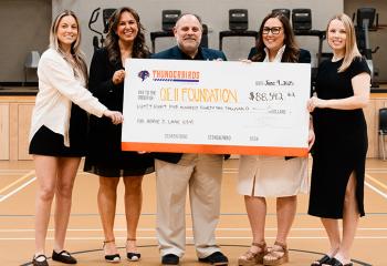 Halifax Thunderbirds representatives present a cheque to the QEII Foundation.