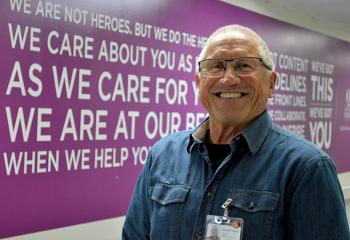 Volunteer Michael Herrick poses for the camera in the QEII's Halifax Infirmary building.