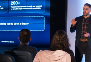 Dr. Abraham Nunes pitches to audience at the QEII Foundation's 2026 Innovation Den