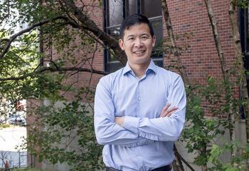Dr. Luke Chen stands outside the QEII.