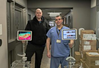 Adam Forrestall (left) and Tom Stears (right), patient attendants at QEII’s Charles V. Keating Emergency and Trauma Centre