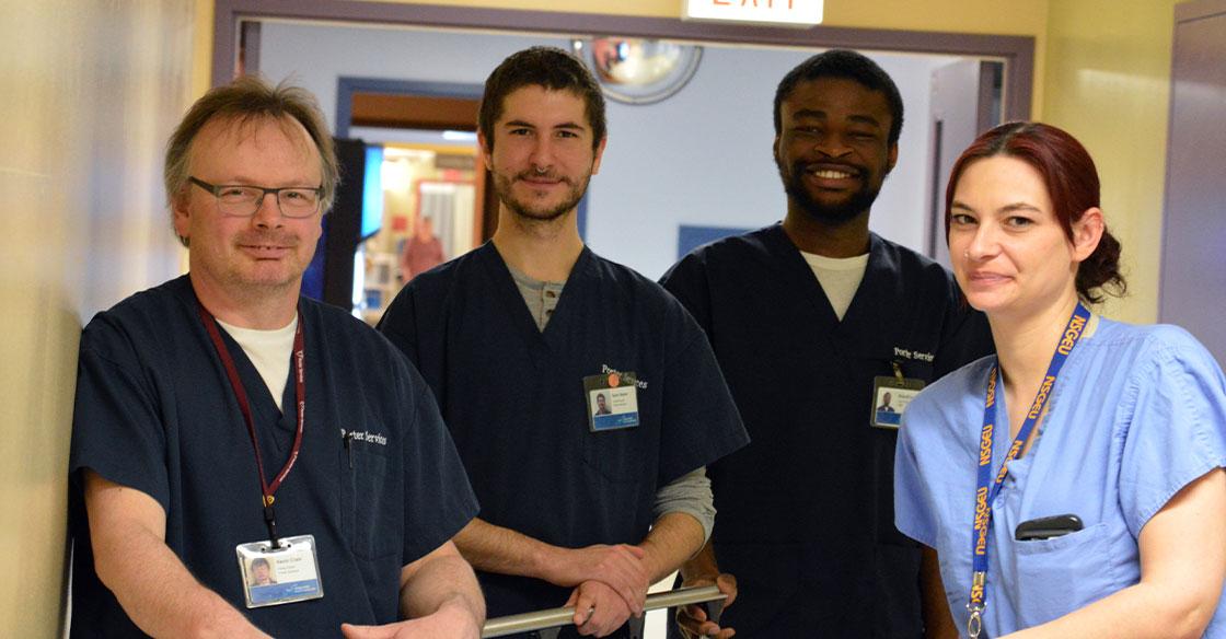 Kevin Crain (left), Sam Baker (centre left), Nnamdi Umahi (centre right) and Mish Manette (right) are part of the team of porters at the QEII.