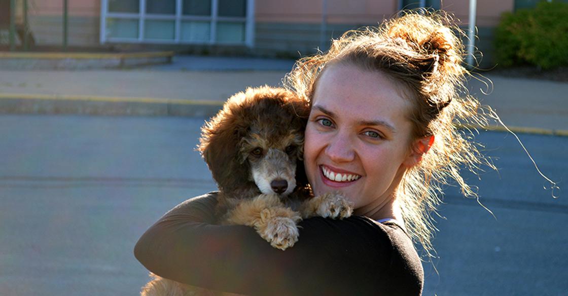 Jocelyn Paul, 2020 Diversity in Health Care Bursary recipient, enjoying the fall sunshine with her miniature poodle puppy, Mary.