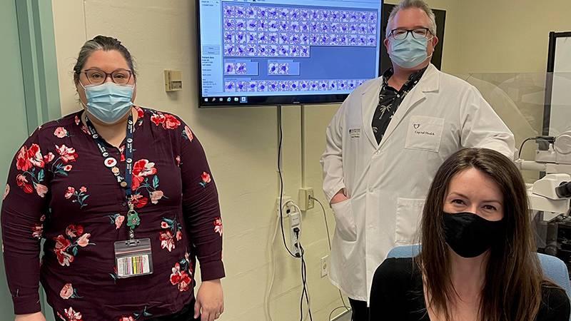 Kimberly Ingalls (left), technical specialist for microscopy, Dr. David Conrad (centre), hematopathologist, and Dr. Tish O’Reilly (right), 