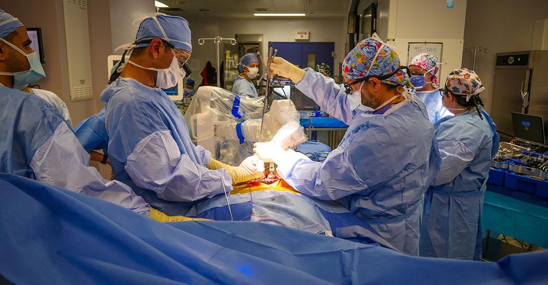 Live surgery shot showing the first spinal robotic patient procedure within a QEII operating room