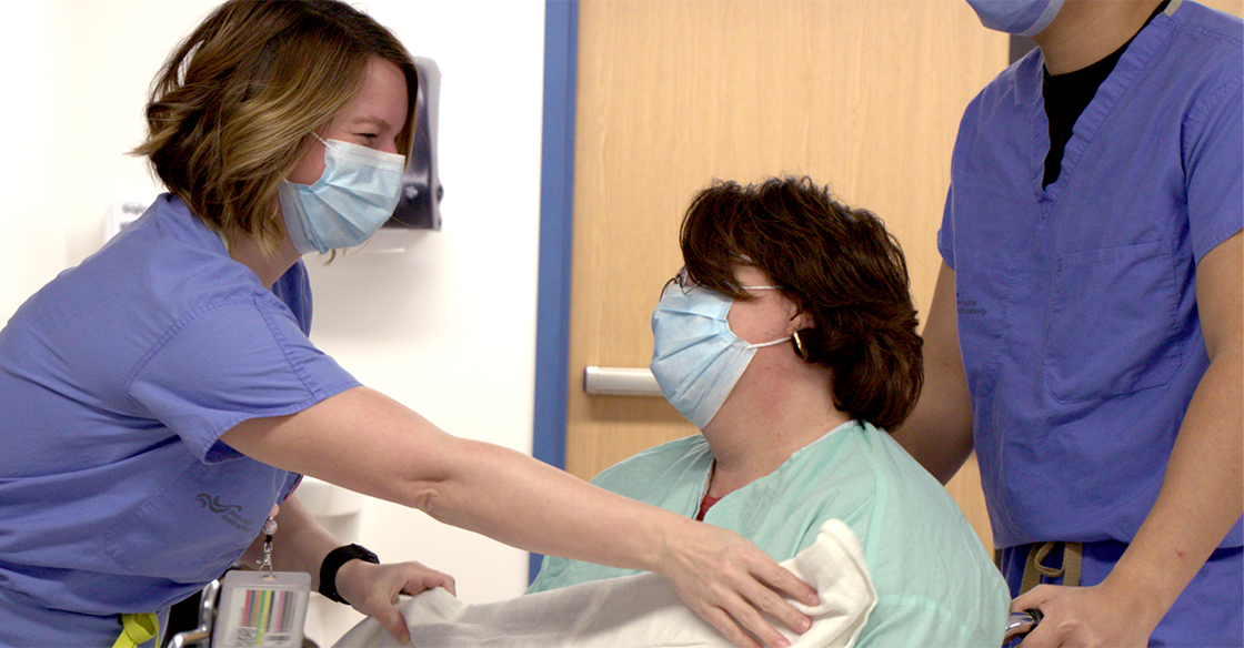 QEII staff covers patient with a blanket