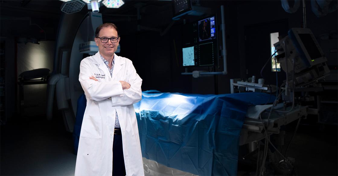 Dr. David Clarke, QEII neurosurgeon stands in a surgery room