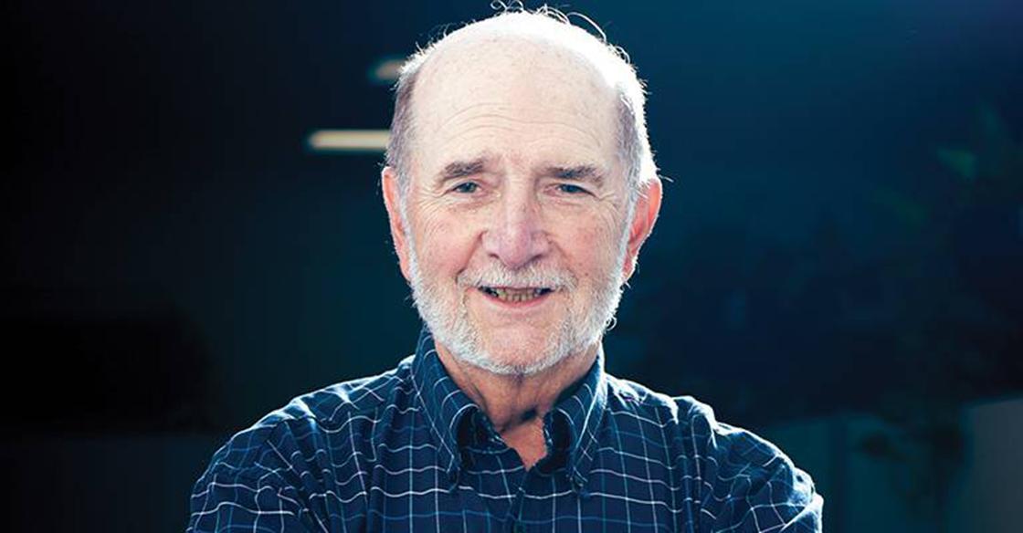A man smiling towards the camera.