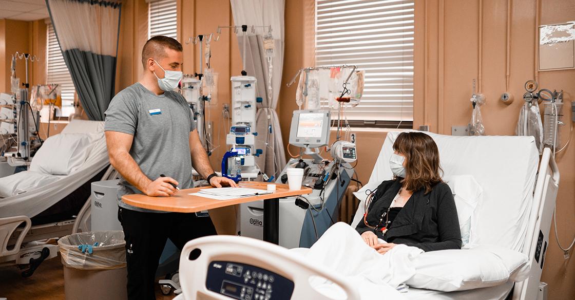 A nurse with a QEII patient