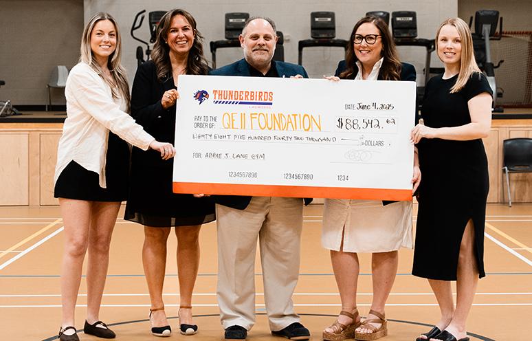 Halifax Thunderbirds representatives present a cheque to the QEII Foundation.