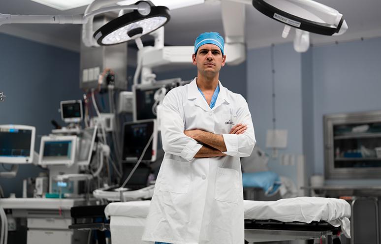 Dr. Roberto Ribeiro poses for the camera in a QEII operating room.