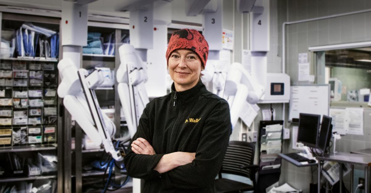 Dr Alison Wallace, pictured in the OR in front of the da Vinci Xi robot