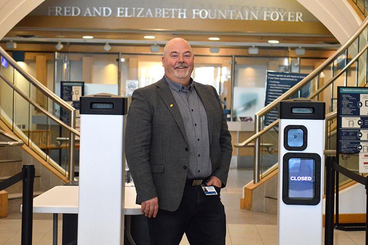 Dean Stienburg, director of security, stands by the AI security scanners.