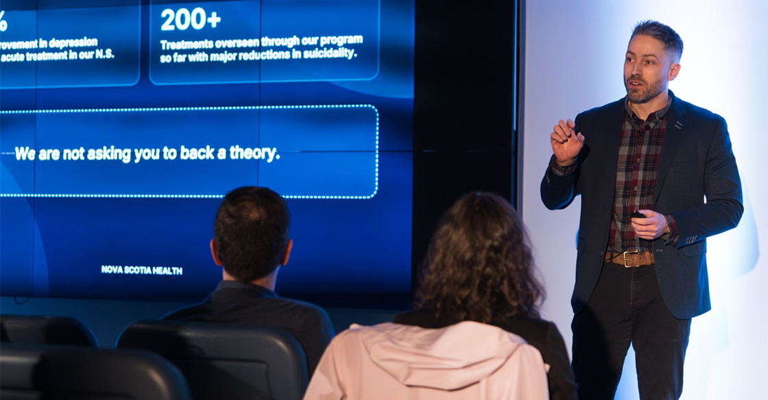 Dr. Abraham Nunes pitches to audience at the QEII Foundation's 2026 Innovation Den