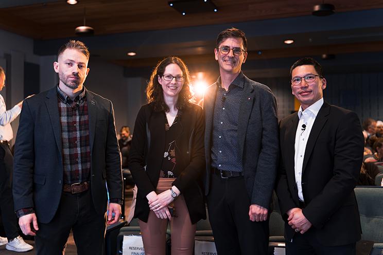 Four QEII clinician scientists pose on a dark background.