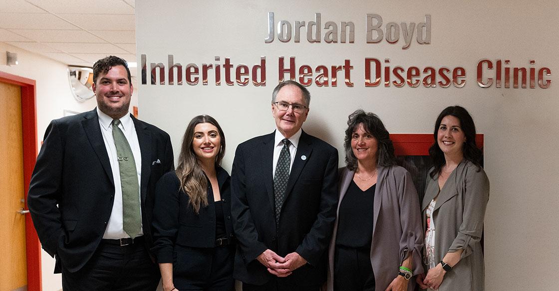 Boyd family stands in front of clinic naming