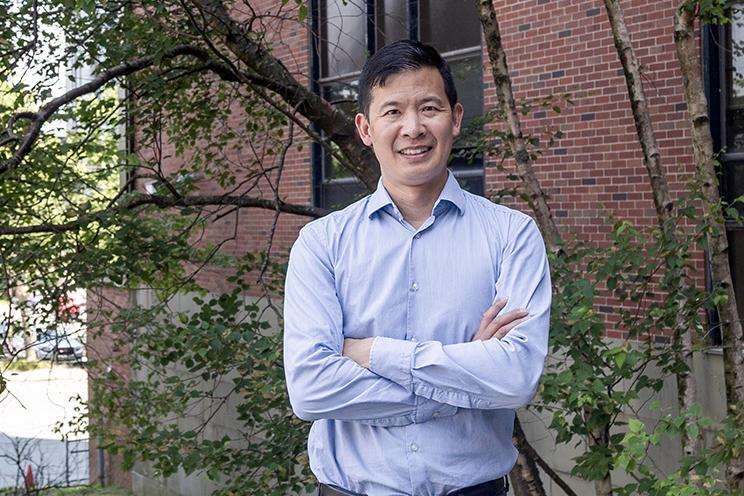 Dr. Luke Chen stands outside the QEII.