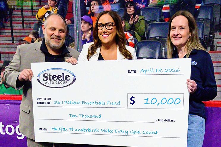 Halifax Thunderbirds present the QEII Foundation with a cheque.