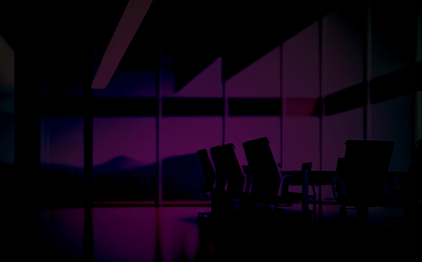 Dark purple overlay on a photo of meeting room