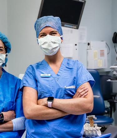 two female health care professional wearing masks