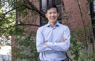 Dr. Luke Chen stands outside the QEII.