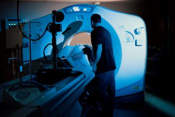 Radiation therapist comfort patients undergoing a CT simulations scan