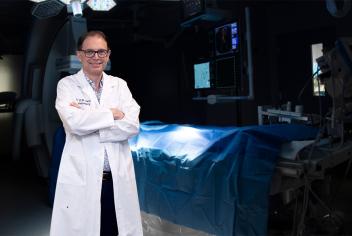 Dr. David Clarke, QEII neurosurgeon stands in a surgery room